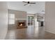Inviting living room featuring a cozy fireplace, tile flooring, and access to the backyard at 1120 E Harbor View Dr, Gilbert, AZ 85234