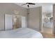 Spacious main bedroom with a large bed, high ceilings, and ensuite bathroom access at 1120 E Harbor View Dr, Gilbert, AZ 85234