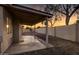 Covered patio area with concrete flooring and block wall in the backyard at 1120 E Harbor View Dr, Gilbert, AZ 85234