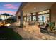 Backyard with covered patio, fire pit, outdoor kitchen and desert landscaping at 11398 E Desert Vista Rd, Scottsdale, AZ 85255
