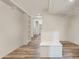 View of the bright unfinished basement with storage and wood-look flooring at 11398 E Desert Vista Rd, Scottsdale, AZ 85255