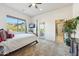 Relaxing bedroom with desert views, television, and adjoining bathroom entrance at 11398 E Desert Vista Rd, Scottsdale, AZ 85255