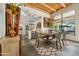 Dining area with wood table, seating for six, and an open view to the updated kitchen at 11398 E Desert Vista Rd, Scottsdale, AZ 85255