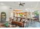 The living room showcases a spacious layout with tile flooring that seamlessly connects to the kitchen and dining areas at 11398 E Desert Vista Rd, Scottsdale, AZ 85255