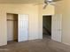 Bedroom featuring a ceiling fan and closet at 11403 W Rosewood Dr, Avondale, AZ 85392