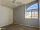 Cozy bedroom with a ceiling fan and a sunny window view at 11403 W Rosewood Dr, Avondale, AZ 85392