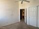 Bedroom with large closet and bathroom access at 11403 W Rosewood Dr, Avondale, AZ 85392