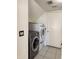 Convenient laundry room with tile flooring, modern washer and dryer set, and access to the outside at 11403 W Rosewood Dr, Avondale, AZ 85392