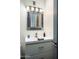Bathroom vanity with framed mirror and contemporary sink adds charm to the space at 11426 E Quail Ln, Cave Creek, AZ 85331