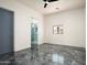 Spacious bedroom features a modern en-suite bathroom and a scenic window showcasing the outdoor landscape at 11426 E Quail Ln, Cave Creek, AZ 85331