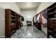 Walk-in closet with custom shelving and organization systems, maximizing storage and style for clothing and accessories at 11426 E Quail Ln, Cave Creek, AZ 85331