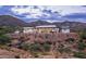 Striking desert home with clean modern design and mountain views at dusk at 11426 E Quail Ln, Cave Creek, AZ 85331