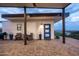 Cozy covered patio with a scenic view, ideal for relaxing and enjoying the outdoors at 11426 E Quail Ln, Cave Creek, AZ 85331