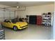 Spacious garage with epoxy flooring, offering ample storage space and parking for vehicles and equipment at 11426 E Quail Ln, Cave Creek, AZ 85331