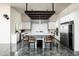 Open concept kitchen boasts a large center island, stainless steel appliances, and modern lighting at 11426 E Quail Ln, Cave Creek, AZ 85331
