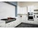 Modern kitchen with stainless steel appliances, sleek white cabinets, and stylish countertops, ideal for cooking at 11426 E Quail Ln, Cave Creek, AZ 85331