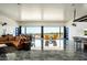 Spacious living room with large windows and doors showcasing desert views at 11426 E Quail Ln, Cave Creek, AZ 85331
