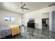 Bright main bedroom with modern decor, tile floors, mountain views, and ample space, a relaxing retreat at 11426 E Quail Ln, Cave Creek, AZ 85331
