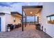 Spacious covered patio with outdoor dining and cooking areas, perfect for entertaining guests at 11426 E Quail Ln, Cave Creek, AZ 85331