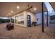 Expansive covered patio with ceiling fan, blue door and views providing ample outdoor living space at 11426 E Quail Ln, Cave Creek, AZ 85331