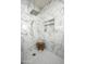 The pristine, marble-tiled shower showcases a built-in shelf and geometric floor tile, offering a spa-like experience at 11426 E Quail Ln, Cave Creek, AZ 85331
