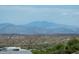 Scenic landscape view featuring rolling hills, mountain ranges, and lush vegetation in a serene setting at 11426 E Quail Ln, Cave Creek, AZ 85331