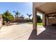 Expansive backyard featuring a swimming pool, palm trees, and plenty of sunshine at 11455 E Persimmon Ave, Mesa, AZ 85212