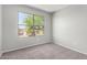 Bedroom with neutral carpet, a large window with a view, and neutral walls at 11455 E Persimmon Ave, Mesa, AZ 85212