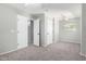 Bright bedroom with neutral walls, ceiling fan, carpet flooring, and a window providing natural light at 11455 E Persimmon Ave, Mesa, AZ 85212