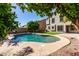 Inviting backyard pool surrounded by lush landscaping and a serene environment at 11455 E Persimmon Ave, Mesa, AZ 85212