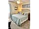 Cozy bedroom with neutral colors, plush bedding, and soft lighting fixtures at 12027 W Morning Dove Dr, Sun City, AZ 85373