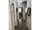 View of hallway with wood floors, neutral paint, and doorway into other rooms at 12027 W Morning Dove Dr, Sun City, AZ 85373