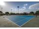 Well-maintained community tennis courts with professional blue surface at 12027 W Morning Dove Dr, Sun City, AZ 85373