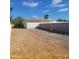 Backyard area featuring a detached garage, gravel, and block wall at 12210 N 67Th St, Scottsdale, AZ 85254