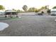 Spacious backyard with gravel area, gazebo, RV parking, seating, and well-maintained surroundings at 12210 N 67Th St, Scottsdale, AZ 85254