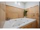 Inviting soaking tub with a tile surround, offering a relaxing retreat in a modern home at 12210 N 67Th St, Scottsdale, AZ 85254