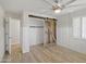 Bright bedroom featuring a sliding barn door closet and a ceiling fan at 12210 N 67Th St, Scottsdale, AZ 85254
