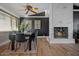 Dining room with hardwood floors, fireplace, and modern décor, perfect for intimate gatherings at 12210 N 67Th St, Scottsdale, AZ 85254