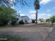 Charming home exterior features a well-maintained lawn and inviting curb appeal, a desert oasis at 12210 N 67Th St, Scottsdale, AZ 85254