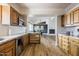 Open kitchen view showcases modern appliances and seamless flow into the dining and living area at 12210 N 67Th St, Scottsdale, AZ 85254