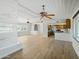Open-concept living space with wood floors, recessed lighting, and seamless flow to the kitchen at 12210 N 67Th St, Scottsdale, AZ 85254