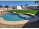 Inviting swimming pool in a backyard oasis, complemented by artificial grass and ample space at 12210 N 67Th St, Scottsdale, AZ 85254