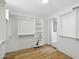 Spacious walk-in closet featuring custom shelving and wood-look flooring at 12210 N 67Th St, Scottsdale, AZ 85254