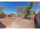 Large backyard featuring a block fence providing privacy and potential for landscaping at 12438 W Flores Dr, El Mirage, AZ 85335