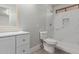 Upgraded bathroom includes a white vanity, modern fixtures, and shower with marble-like accents at 12438 W Flores Dr, El Mirage, AZ 85335