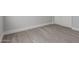 Neutral plank flooring that offers a versatile design in a bright bedroom at 12438 W Flores Dr, El Mirage, AZ 85335