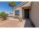 Inviting front porch featuring a seating area and secure entry to the home at 12438 W Flores Dr, El Mirage, AZ 85335
