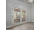 Plank flooring and bright patio doors that lead to the outdoor living space at 12438 W Flores Dr, El Mirage, AZ 85335