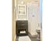 This updated bathroom features new gray vanity and a step-in shower with designer curtain at 1309 W 10Th St, Tempe, AZ 85281