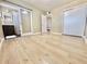 Bedroom features new light wood floors and adjacent bathroom at 1309 W 10Th St, Tempe, AZ 85281